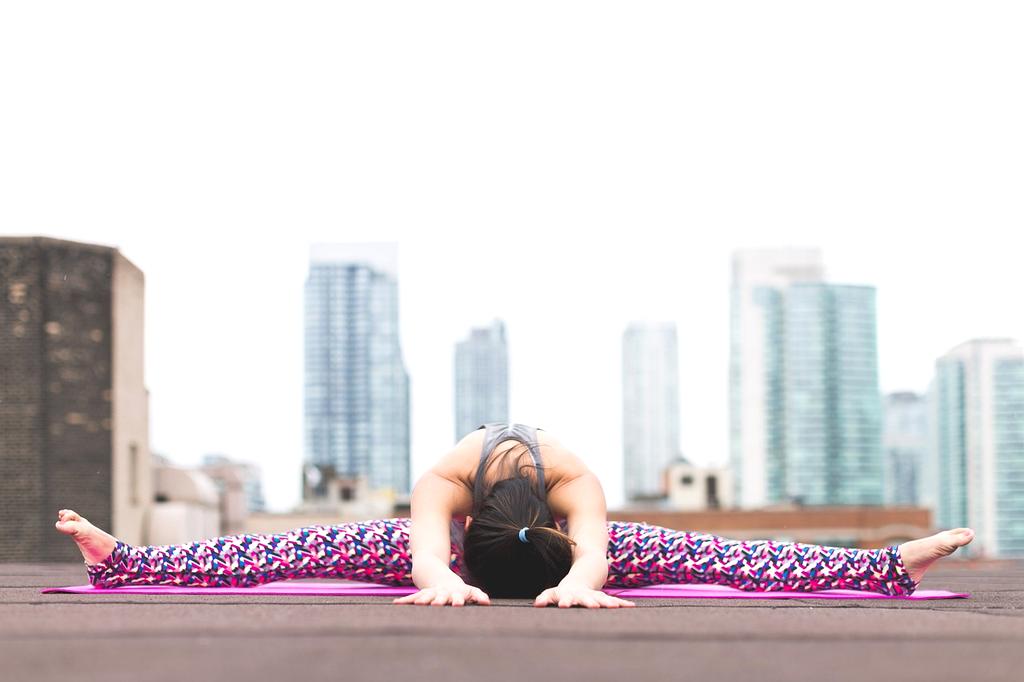 Green rooftop with solar panels on city building